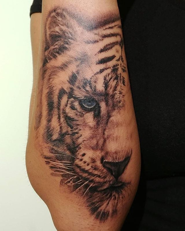 Que symbolise un tigre sur un tatouage?