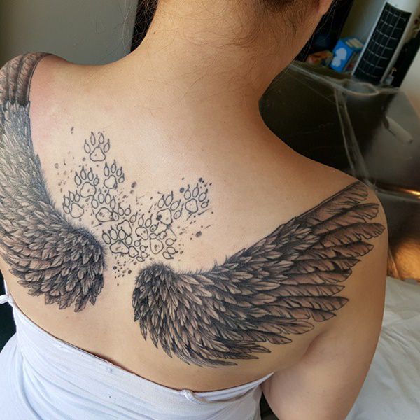 Que symbolisent des ailes d'ange sur un tatouage?