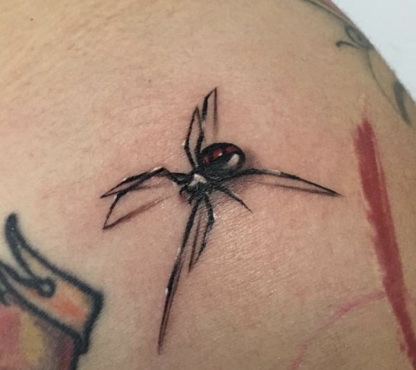 Que symbolise une araignée sur un tatouage?