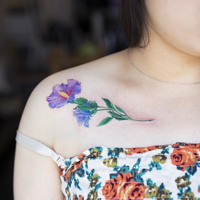 tatouage fleur 53