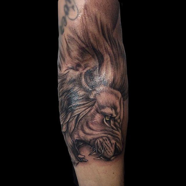 tatouage lion 115